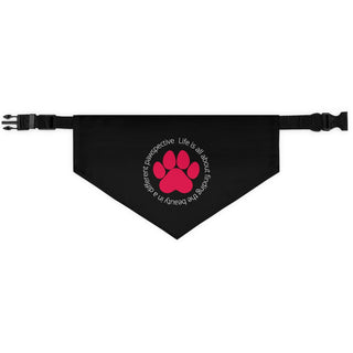 Different Pawspective Dog Collar Bandana in Black. The Different Pawspective design features the phrase "Life is all about finding the beauty in a different pawspective" around a paw print. Comes with adjustable black collar.