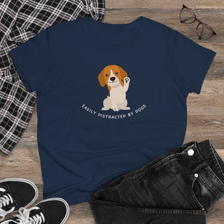 Easily Distracted Women's Midweight Cotton Tee in Team Navy. Shown is front design featuring a dog waving with the saying "Easily Distracted by Dogs" below it. The back of shirt has the classic Benefit Beagle Logo.