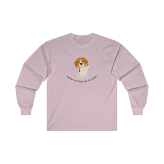 Easily Distracted Ultra Cotton Long Sleeve Tee in Light Pink. Shown is front design featuring a dog waving with the saying "Easily Distracted by Dogs" below it. The back of shirt has the classic Benefit Beagle Logo.