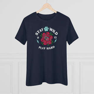 Stay Wild Women's Premium Tee in Navy. Shown is front of Stay Wild Design features a tattoo style rose with the phrase "Stay Wild, Play Hard" around it. The back of shirt features the Stay Wild Benefit Beagle Logo Design.