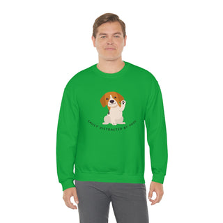 Easily Distracted Unisex Heavy Blend Crewneck Sweatshirt in Kelly Green. Shown is front design featuring a dog waving with the saying "Easily Distracted by Dogs" below it. The back of shirt has the classic Benefit Beagle Logo.