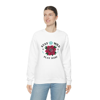 Stay Wild Unisex Heavy Blend Crewneck Sweatshirt in White. The Stay Wild Design features a tattoo style rose with the phrase "Stay Wild, Play Hard" around it. The back of shirt features the Stay Wild Benefit Beagle Logo Design.