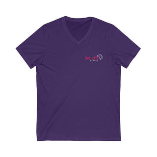 Different Pawspective Unisex V-Neck Tee in Purple. Shown is front of shirt with Benefit Beagle logo in the top corner . On the back is large colorful pawprint with the the phrase "Life is all about finding the beauty in a different pawspective" circled around it.