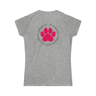 Different Pawspective Women's Softstyle Tee in Sport Grey. Shown is the back of shirt featuring a large colorful pawprint with the the phrase "Life is all about finding the beauty in a different pawspective" circled around it. The Benefit Beagle Logo is located in the top corner on the front of shirt.