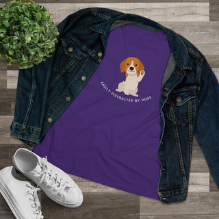 Easily Distracted Women's Premium Tee in Team Purple. Shown is front design featuring a dog waving with the saying "Easily Distracted by Dogs" below it. The back of shirt has the classic Benefit Beagle Logo.