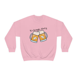 Beagle-Thirty Mugs Unisex Heavy Blend Crewneck Sweatshirt in Light Pink. The front of shirt showcases Two Dog Adorned Mugs clinking with the saying, "It's Beagle-Thirty" above it. Back of shirt features corresponding Benefit Beagle Logo.