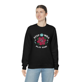 Stay Wild Unisex Heavy Blend Crewneck Sweatshirt in Black. The Stay Wild Design features a tattoo style rose with the phrase "Stay Wild, Play Hard" around it. The back of shirt features the Stay Wild Benefit Beagle Logo Design.