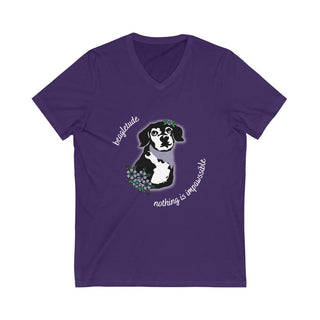 Signature Tattoo Flowers Unisex Jersey Short Sleeve V-Neck Tee in Purple. Shown is front of shirt with the Signature Tattoo Flowers design featuring a dog with flowers around it and the phrase "Beagletude" and "Nothing is Impawssible". Back of shirt features the Benefit Beagle Logo.