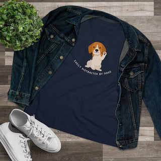 Easily Distracted Women's Premium Tee in Navy. Shown is front design featuring a dog waving with the saying "Easily Distracted by Dogs" below it. The back of shirt has the classic Benefit Beagle Logo.