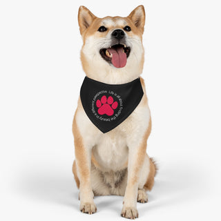 Dog wearing the Different Pawspective Dog Collar Bandana in Black. The Different Pawspective design features the phrase "Life is all about finding the beauty in a different pawspective" around a paw print. Comes with adjustable black collar.