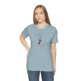 Dog Hair is my Glitter Unisex Jersey Short Sleeve Tee in Light Blue. The Dog Hair is my Glitter design features a dog with the phrase "Dog Hair is my Glitter" above it and it is surrounded by a circle with paw prints.