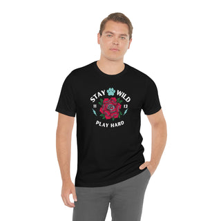 Stay Wild Unisex Premium Tee in Black. Shown is front of Stay Wild Design features a tattoo style rose with the phrase "Stay Wild, Play Hard" around it. The back of shirt features the Stay Wild Benefit Beagle Logo Design.