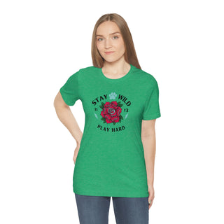 Stay Wild Unisex Premium Tee in Heather Kelly. Shown is front of Stay Wild Design features a tattoo style rose with the phrase "Stay Wild, Play Hard" around it. The back of shirt features the Stay Wild Benefit Beagle Logo Design.