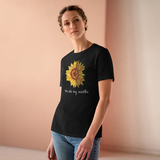 You are my Sunshine Women's Premium Tee shirt in Black. Shown is the front showcasing a sunflower which is split down the middle and half is made out of paw prints. Underneath is the phrase "You are my Sunshine" . Back of shirt features the Sunflower Benefit Beagle Logo.