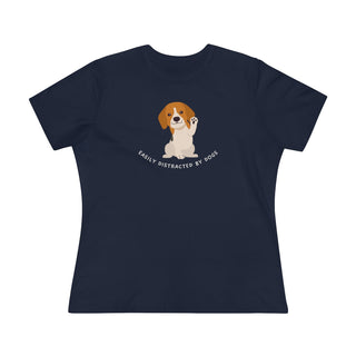 Easily Distracted Women's Premium Tee in Navy. Shown is front design featuring a dog waving with the saying "Easily Distracted by Dogs" below it. The back of shirt has the classic Benefit Beagle Logo.