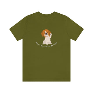 Easily Distracted Unisex Jersey Short Sleeve Tee in Olive. Shown is front design featuring a dog waving with the saying "Easily Distracted by Dogs" below it. The back of shirt has the classic Benefit Beagle Logo.