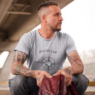 Adventures Await Unisex Jersey Short Sleeve Tee in Athletic Heather. The front of shirt features the Adventures Await design with a dog inside a nautical compass and the words "Adventures Await" above it. The back of the shirt has similar Benefit Beagle Logo. 