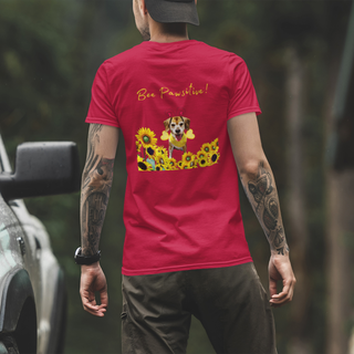 Bee Pawsitive Unisex V-neck Tee shirt in Red. Shown is back of shirt showcasing a dog dressed as as bee in a a field of sunflowers with the phrase "Bee Pawsitive!" above it. The front features the Bee Pawsitive Benefit Beagle Logo.