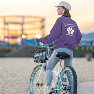 Brightest Star unisex Crewneck Sweatshirt in purple. The Brightest Star design features a design on the back with the phrase "The brightest stars are those who shine for the benefit of others" with a pawprint and a nautical star.