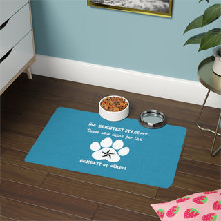 Brightest Star pet food mat in blue. The Brightest Star design features a design on the back with the phrase "The brightest stars are those who shine for the benefit of others" with a pawprint and a nautical star.