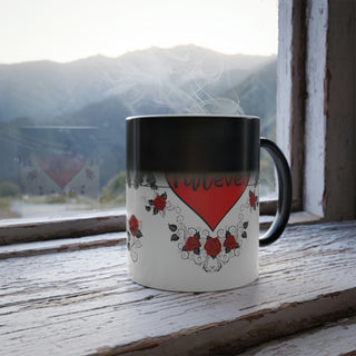 Color morphing mug with dogs with bowties and roses and the center hearts reading, "be mine" and "furever". Mug is white with design when filled with hot beverage. When cool or empty, mug color morphs to dark.