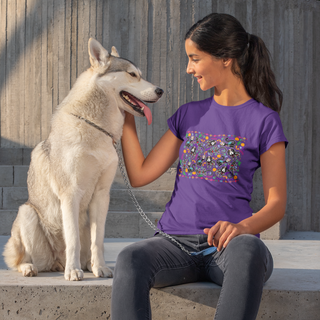 Dia De Los Muertos Women's Midweight Cotton Tee Shirt in Purple. Shown is the front of shirt featuring print of dogs and cats with Dia de los Muertos traditional decorations. On the back is a similar Benefit Beagle Logo.