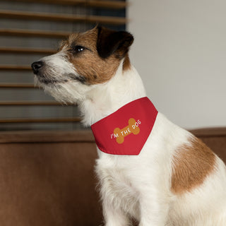 Dog wearing Easily Distracted Dog Collar Bandana in Red. The design features a large dog bone with the words, "I'M THE DOG" written across it. Comes with adjustable black collar.