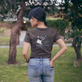 Lincoln Butterfly Women's Softstyle Tee in Dark Chocolate. Shown is back of shirt design showcasing profile of a dog with a blue butterfly on its nose and the phrase "Kindness is Strength" next to it. The front of shirt has Benefit Beagle Logo kissed by a Butterfly.