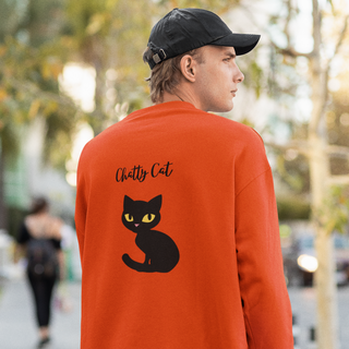 Meow Unisex Crewneck Sweatshirt in Orange. Shown is back showcasing a wide eyed black cartoon cat with the phrase "Chatty Cat" above it. On front of shirt is the Benefit Beagle Logo featuring a peeping cat.