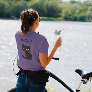 Meow Women's Softstyle Tee in Purple. Shown is back showcasing a wide eyed black cartoon cat with the phrase "Chatty Cat" above it. On front of shirt is the Benefit Beagle Logo featuring a peeping cat.