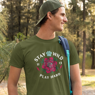 Stay Wild Unisex Premium Tee in Olive. Shown is front of Stay Wild Design features a tattoo style rose with the phrase "Stay Wild, Play Hard" around it. The back of shirt features the Stay Wild Benefit Beagle Logo Design.