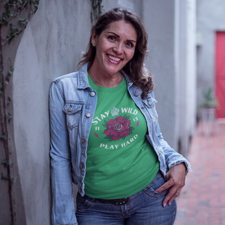 Stay Wild Women's Midweight Cotton Tee in Irish Green.  Shown is front of Stay Wild Design features a tattoo style rose with the phrase "Stay Wild, Play Hard" around it. The back of shirt features the Stay Wild Benefit Beagle Logo Design.