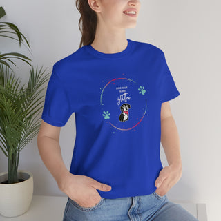 Dog Hair is my Glitter Unisex Jersey Short Sleeve Tee in True Royal. The Dog Hair is my Glitter design features a dog with the phrase "Dog Hair is my Glitter" above it and it is surrounded by a circle with paw prints.