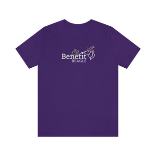 Witchy Cat Unisex Jersey Short Sleeve Tee. Front side shown in Purple with a Seasonal Benefit Beagle Logo Design. Back side showcases Wide Eyed Cartoon Cat wearing Purple Hat Standing over Broom. "Crossing Paths Since 1692". Purrfect for Halloween, or anytime!