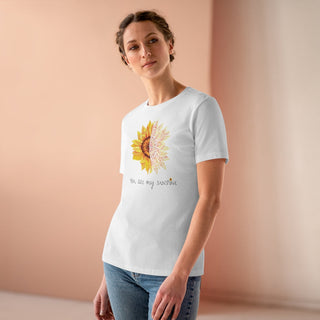 You are my Sunshine Women's Premium Tee shirt in White. Shown is the front showcasing a sunflower which is split down the middle and half is made out of paw prints. Underneath is the phrase "You are my Sunshine" . Back of shirt features the Sunflower Benefit Beagle Logo.