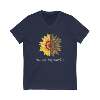 You are my Sunshine Unisex V-Neck Tee in Navy. Shown is the front showcasing a sunflower which is split down the middle and half is made out of paw prints. Underneath is the phrase "You are my Sunshine" . Back of shirt features the Sunflower Benefit Beagle Logo.