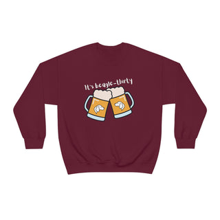 Beagle-Thirty Mugs Unisex Heavy Blend Crewneck Sweatshirt in Maroon. The front of shirt showcases Two Dog Adorned Mugs clinking with the saying, "It's Beagle-Thirty" above it. Back of shirt features corresponding Benefit Beagle Logo.