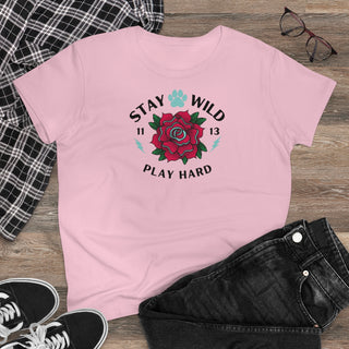 Stay Wild Women's Midweight Cotton Tee in Light Pink. Shown is front of Stay Wild Design features a tattoo style rose with the phrase "Stay Wild, Play Hard" around it. The back of shirt features the Stay Wild Benefit Beagle Logo Design.