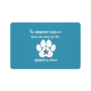 Brightest Star pet food mat in blue. The Brightest Star design features a design on the back with the phrase "The brightest stars are those who shine for the benefit of others" with a pawprint and a nautical star.