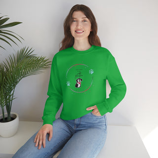 Dog Hair is my Glitter Unisex Crewneck in Irish Green. The Dog Hair is my Glitter design features a dog with the phrase "Dog Hair is my Glitter" above it and it is surrounded by a circle with paw prints.