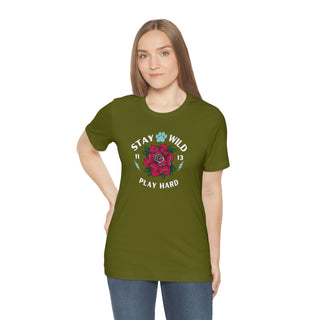 Stay Wild Unisex Premium Tee in Olive. Shown is front of Stay Wild Design features a tattoo style rose with the phrase "Stay Wild, Play Hard" around it. The back of shirt features the Stay Wild Benefit Beagle Logo Design.