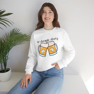 Beagle-Thirty Mugs Unisex Heavy Blend Crewneck Sweatshirt in White. The front of shirt showcases Two Dog Adorned Mugs clinking with the saying, "It's Beagle-Thirty" above it. Back of shirt features corresponding Benefit Beagle Logo.