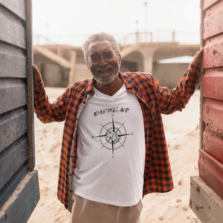 Adventures Await Unisex V-Neck Tee in White. The front of shirt features the Adventures Await design with a dog inside a nautical compass and the words "Adventures Await" above it. The back of the shirt has similar Benefit Beagle Logo.