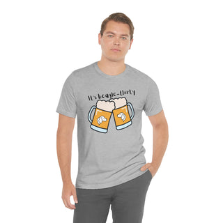 Beagle-Thirty Mugs Unisex Jersey Short Sleeve Tee in Athletic Heather. The front of shirt showcases Two Dog Adorned Mugs clinking with the saying, "It's Beagle-Thirty" above it. Back of shirt features corresponding Benefit Beagle Logo.