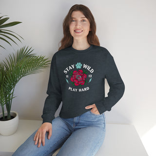 Stay Wild Unisex Heavy Blend Crewneck Sweatshirt in Dark Grey Heather. The Stay Wild Design features a tattoo style rose with the phrase "Stay Wild, Play Hard" around it. The back of shirt features the Stay Wild Benefit Beagle Logo Design.