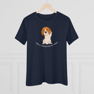 Easily Distracted Women's Premium Tee in  Navy. Shown is front design featuring a dog waving with the saying "Easily Distracted by Dogs" below it. The back of shirt has the classic Benefit Beagle Logo.