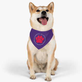 Dog wearing the Different Pawspective Dog Collar Bandana in Purple. The Different Pawspective design features the phrase "Life is all about finding the beauty in a different pawspective" around a paw print. Comes with adjustable black collar.