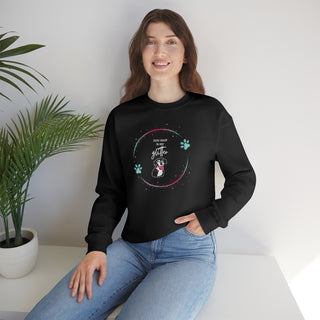 Dog Hair is my Glitter Unisex Crewneck in Black. The Dog Hair is my Glitter design features a dog with the phrase "Dog Hair is my Glitter" above it and it is surrounded by a circle with paw prints.