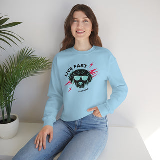 Play Hard Unisex Heavy Blend Crewneck Sweatshirt in Light Blue. The design features a cool dog with sunglasses and lightening bolts around it. The phrase "Live Fast, Play Hard" is around the design.