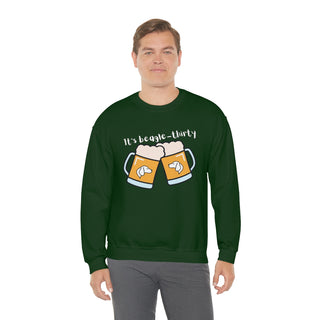 Beagle-Thirty Mugs Unisex Heavy Blend Crewneck Sweatshirt in Forest Green. The front of shirt showcases Two Dog Adorned Mugs clinking with the saying, "It's Beagle-Thirty" above it. Back of shirt features corresponding Benefit Beagle Logo.